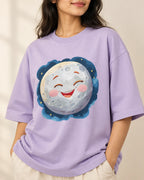 Close-up of the Moon Stellar Squad print on a lavender oversized French terry T-shirt, Fourth Dimension Club