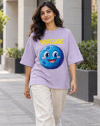 Model wearing the Neptune Stellar Squad oversized French terry T-shirt in lavender by Fourth Dimension Club on a city street