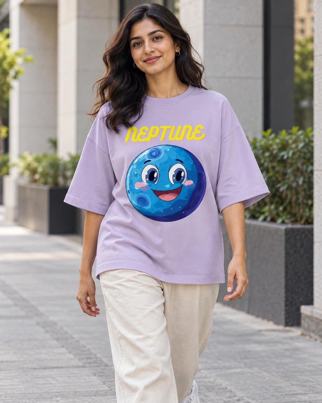 Model wearing the Neptune Stellar Squad oversized French terry T-shirt in lavender by Fourth Dimension Club on a city street