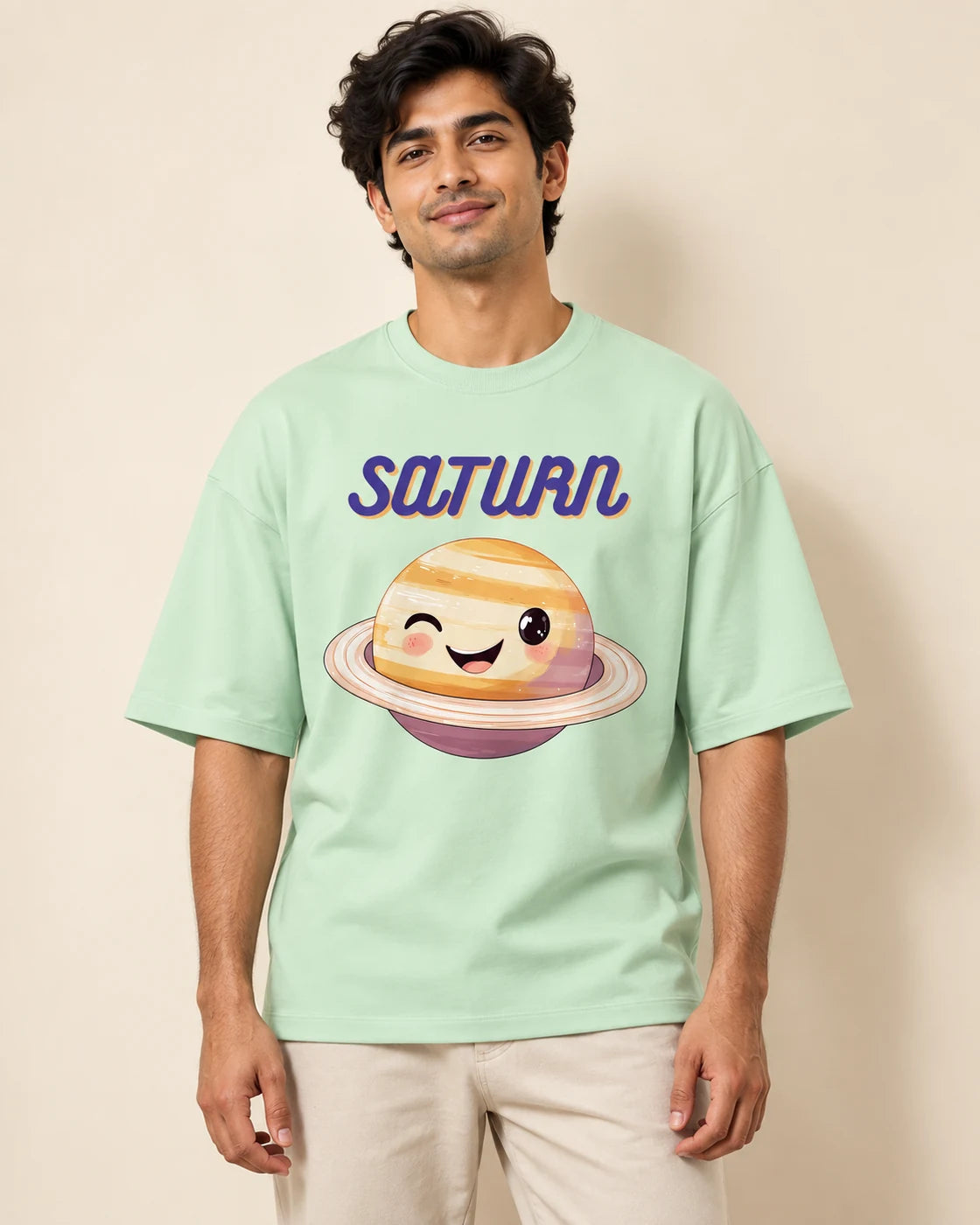 Saturn Stellar Squad oversized French terry T-shirt in jade by Fourth Dimension Club, front view on model