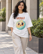 Model wearing the Venus Stellar Squad oversized French terry T-shirt in white by Fourth Dimension Club on a city street